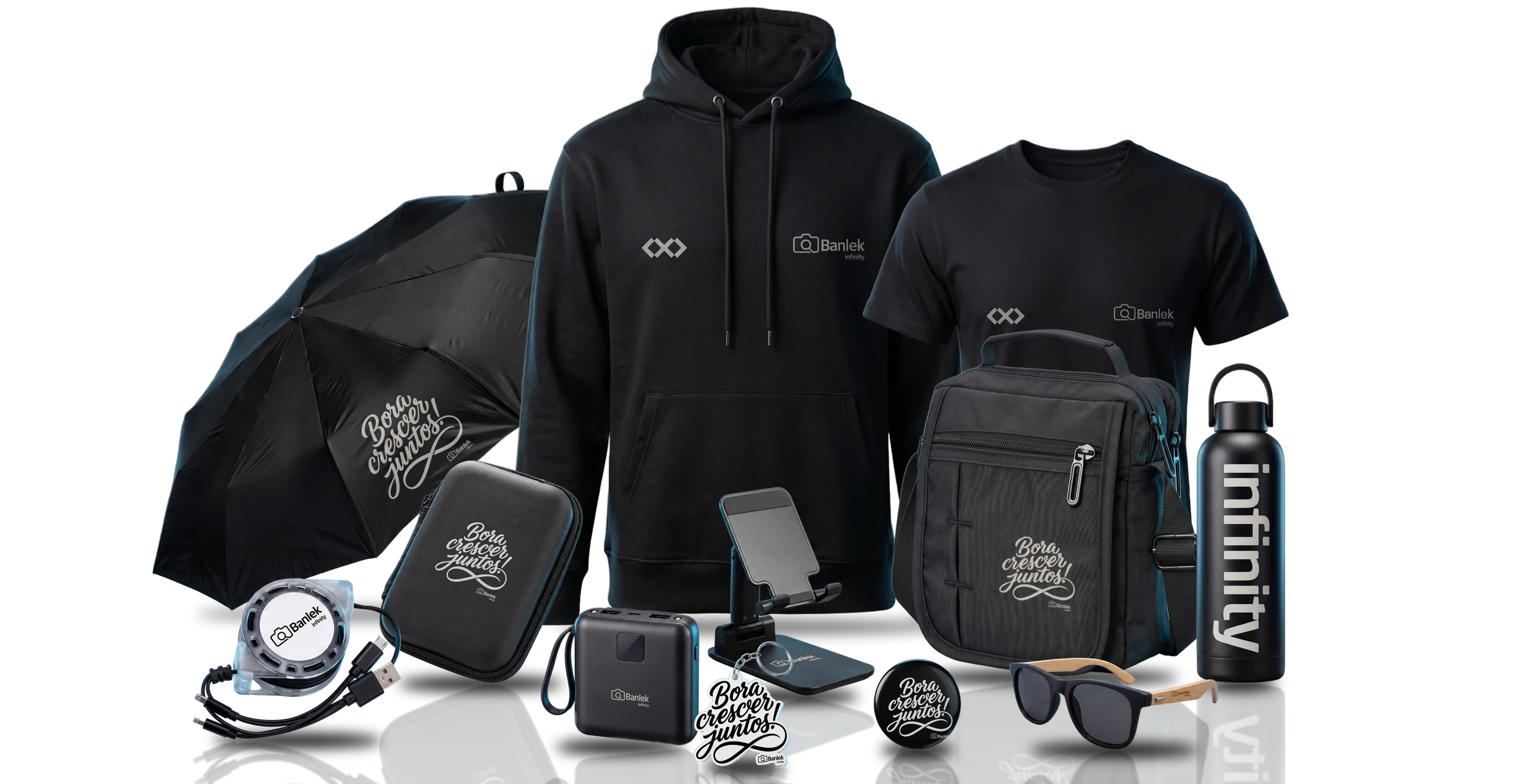 Os 12 itens do Kit Infinity juntos: moletom, camiseta, guarda-chuva, bolsa, garrafa, case, suporte de celular, cabo 3 em 1, power bank, óculos, chaveiro e botton